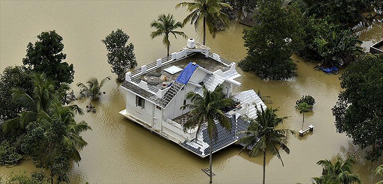 A house is partially submerged in flood waters in Chengannur in the southern state of Kerala, India, Sunday, Aug.19, 2018. (AP Photo)