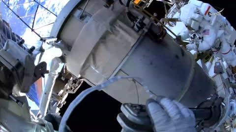 Astronauts Float Outside the ISS