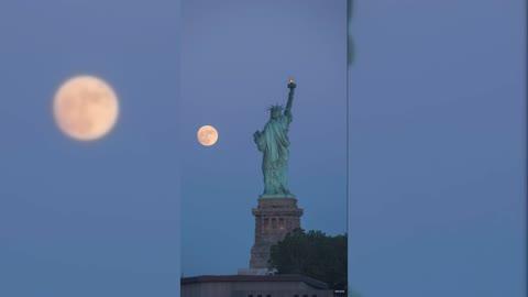 Glowing Strawberry Moon Rises Over Statue of Liberty in Timelapse Footage