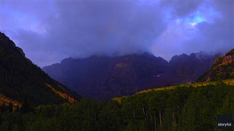 Rainbow Shines Among Colorful Fall Foliage in Beautiful Timelapse Footage