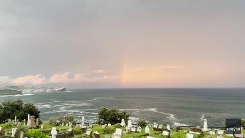 Lightning Strikes Next to Rainbow