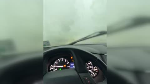 Driver Shelters in Car from Intense Storm