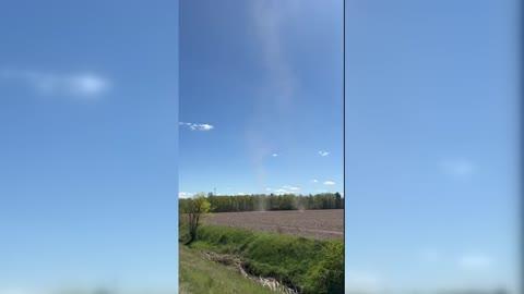 Twin Dust Devils Swirl Above Michigan Field