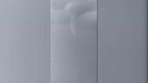 Funnel Cloud Spotted During Thunderstorm