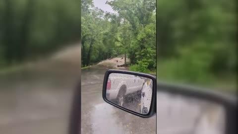 Water Rushes Over Road as Heavy Rain Brings Flash Flooding to Central Kentucky