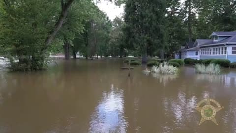 Damage to Bridge and Submerged Buildings Seen in Drone Footage of Indiana Flooding