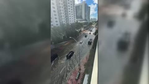 Cars Drive Through Floodwaters as King Tide Inundates Miami Beach